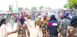 Policemen cane-charge agitating teachers at Lambi village in Muktsar district on Tuesday. A Tribune photograph