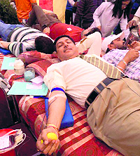 Volunteers donate blood at a camp organised by a private organisation in Chandigarh on Wednesday