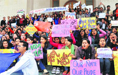 Doon University students protest in Dehradun on Wednesday against the state government, which renamed the university as Maharishi Valmiki University. A tribune photograph 