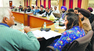 Additional Deputy Commissioner (Development) Isha Kalia presides over a district-level review committee meeting at Bachat Bhawan in Ludhiana