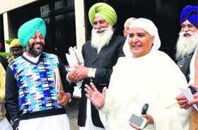Bibi Jagir Kaur shares a light moment with Congress MLAs Gurkirat Singh and Ajit Singh Mofar after the assembly session on Wednesday