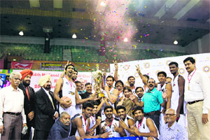 The Tamil Nadu men pose with the trophy after beating Punjab 74-57 in the final