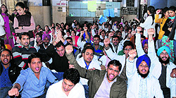 Students of Government Medical College protest at Guru Nanak Dev Hospital in Amritsar on Thursday