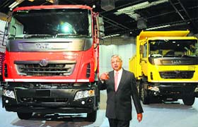 Tata Motors' executive director Ravindra Pisharody poses with Prima LX range of heavy commercial vehicles in New Delhi on Thursday