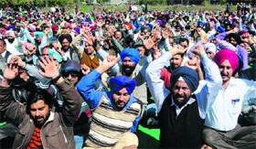 Members of the Punjab State Ministerial Services Association protest in support of their demands, including grade pay, revision of pay scales and other allowances, at Sector 34 in Chandigarh on Thursday.