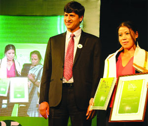 Indian woman boxer M C Mary Kom being felicitated during the launch of the 25th Edition of the Limca Book of Records in New Delhi on Thursday.
