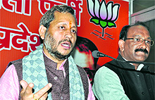 BJP state president Teerath Singh Rawat addresses a press conference at the party office in Dehradun on Thursday