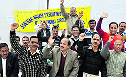 Members of Bharat Sanchar Nigam Limited's Executives Association protest at the BSNL Rajpur Road office in Dehradun on Thursday