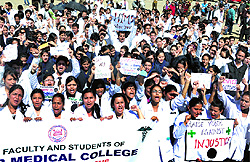 Doctors and medical students protest at Parade Ground in Dehradun on Thursday against the maltreatment of medical students in Kanpur