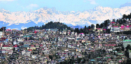 An aerial view of Shimla with the snow-capped mountains on Tuesday. 