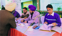 PUDA officials at the auction of commercial sites in Jalandhar on Thursday. A Tribune photograph