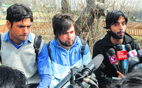 Students suspended from a Meerut university address mediapersons in Srinagar on Thursday.