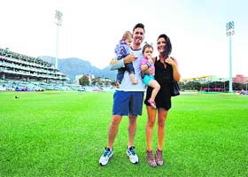 Graeme Smith and his wife, Morgan Smith, pose with their daughters on the pitch on Day 5 of the third Test in Capetown