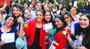 Girls in a jubilant mood after receiving prizes during a function at MCM DAV College in Sector 36, Chandigarh, on Friday.