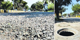 A road in Shaheed Bhagat Singh Nagar, Ludhiana; and (right) an uncovered manhole.