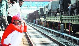 Maya Devi waits for passengers at the railway station in Ludhiana.
