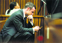 Paralympic track star Oscar Pistorius sits in the dock during the fifth day of his trial for the murder of his girlfriend Reeva Steenkamp at the North Gauteng High Court in Pretoria. Reuters