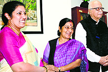 Former UPA minister Daggubati Purandeswari meets senior BJP leader Sushma Swaraj (centre) as LK Advani looks on