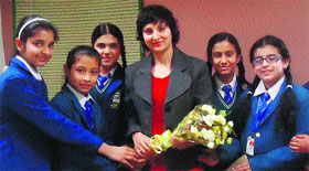 Students of DAV International School honour Dr Taranjit Kaur during a programme organised to mark World Womens Day.