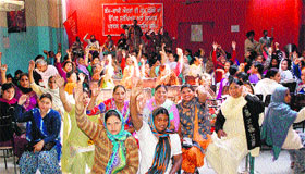 Women raise siogans during a programme organised by AITUC and AIWWF to celebrate World Womens Day in Amritsar on Saturday.