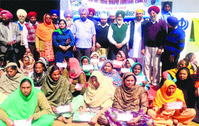 Monthly widow pension cheques were distributed to the widow of Maqboolpura by Sarbat Da Bhala Trust members in Amritsar on Saturday.
