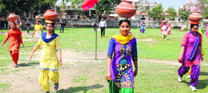 Students of Punjabi University Regional Campus participate in a pot race during the athletics meet in Bathinda on Saturday.
