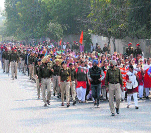 Members of the Anganwari Mulazam Union, Punjab, hold a protest march in Bathinda on Saturday.