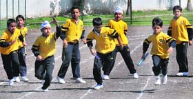 Students take part in the relay race during the annual sports day at Vivek High School, Sector 7, Chandigarh, on Saturday
