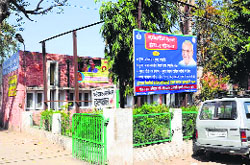 A state government hoarding at a PHC in Old Faridabad.