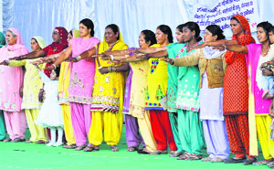 Women take pledge against the veil system during a state-level convention at Kalidas Rangshala in Karnal on Saturday.