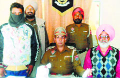 A drug peddler in police custody in Jagraon. A trIbune photograph