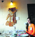 yushi Daula with her creation at the art exhibition organised at Bistro 226 in Ludhiana. Tribune photo