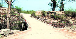 The badly damaged bridge that connects the village with the rest of the state