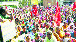 Mid-day meal workers protest near FM Parminder Dhindsa's house in Sangrur on Saturday