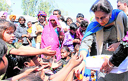 MP Preneet Kaur distributes sweets among slum children in Patiala on Saturday