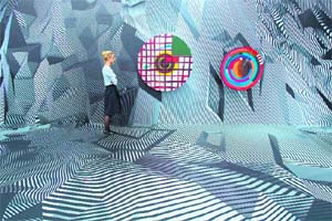 A woman poses next to the works "Large Cuckoo clock" and "Small Cuckoo clock" by German artist Tobias Rehberger during the show "Tobias Rehberger  Home and Away and Outside" at the Schirn Kunsthalle museum in Frankfurt am Main, western Germany. The Schirn Kunsthalle is running till May 11