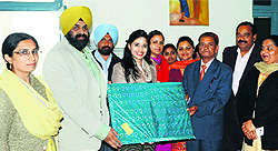 Members of Punjabi Samvad honour guest speaker Simran Puar during a seminar in Amritsar