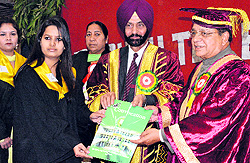 Mayor Bakshi Ram Arora (right) and Principal Nanak Singh award degrees to students at a convocation ceremony in Amritsar on Sunday
