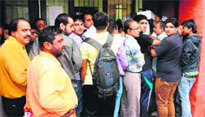 Vehicle owners wait for their turn to submit forms at the RLA office in the Industrial Area, Phase I, in Chandigarh. 