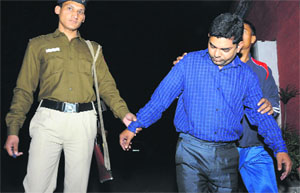 Sakir Sheikh, one of the accused, in police custody.