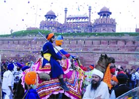 Sikh devotees take part in a procession on the occasion of the Fateh Diwas near Red Fort In Delhi on Sunday