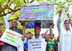 Members of the Hindustan Krantikari Dal shout slogans during an awareness programme for the forthcoming Lok Sabha elections, at Jantar Mantar in New Delhi on Sunday
