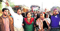 Anupama Rawat, daughter of Chief Minister Harish Rawat, leads a march of the local people in Haridwar