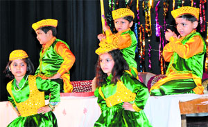 Tiny tots of DRS Kids, Talab Tillo, perform cultural items during the annual day function in Jammu on Sunday.