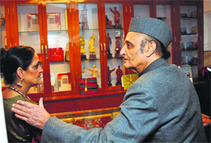 MP Dr Karan Singh interacts with a woman at the inauguration of the Maharaja Hari Singh room at the Amar Mahal Museum in Jammu on Sunday. 