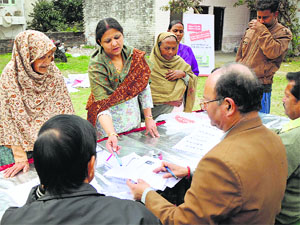 Voters submit their applications to register themselves for the upcoming elections in Jammu