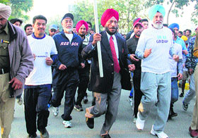 Olympian Milkha Singh flags off the Half Marathon of 22 km organised by the CT Group of Instiitutions in Jalandhar on Sunday.