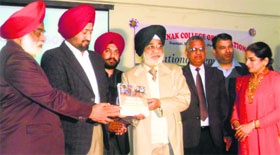 Organisers release a book on RTE papers at the Guru Nanak College of Education in Gopalpur village near Mandi Ahmedgarh.