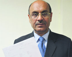 Complainant Harish Sood shows a copy of the FIR in Ludhiana on Sunday.