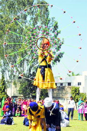 Girls perform gatka at the Government College in Patiala on Sunday.